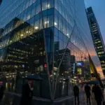 Modern corporate skyscraper at twilight representing the business environment for Fractal Analytics.
